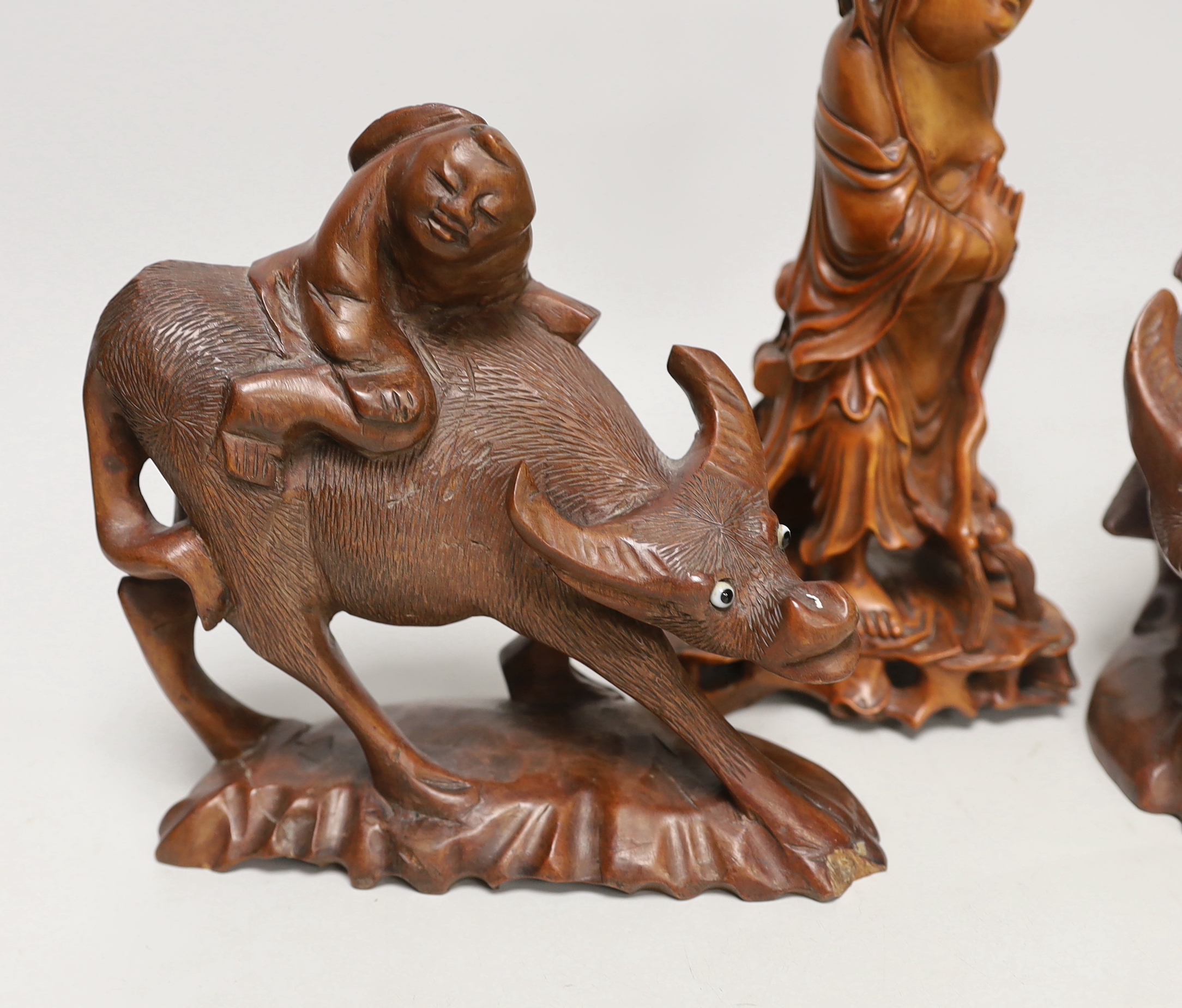 Three Chinese carved hardwood figures, tallest 23cm